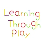 Bright, colorful magnetic letters spelling "Learning Through Play" for educational fun.