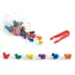 a jar with plastic animals and tweezers