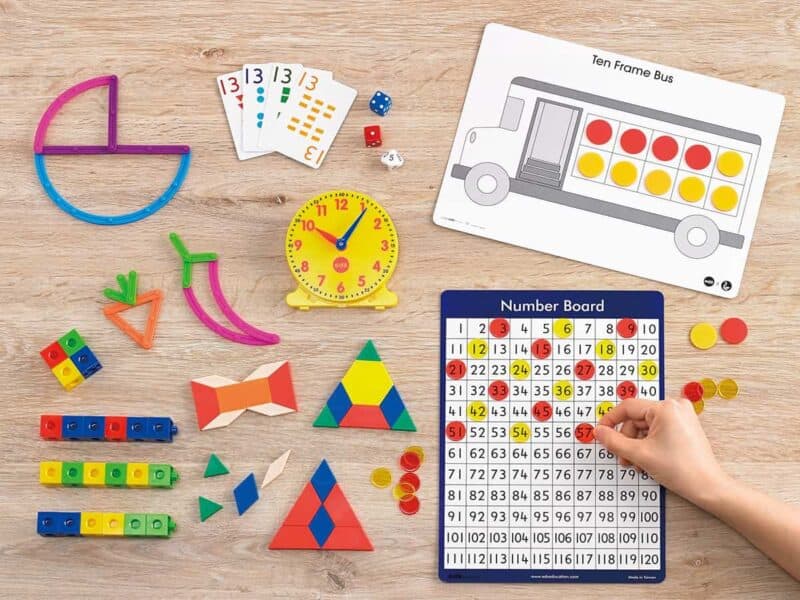 a hand touching a board game