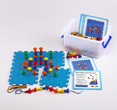 a plastic container with colorful pieces and a plastic box with cards