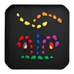 a black tray with colorful stones on it