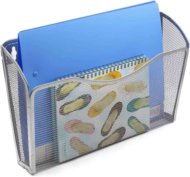 A blue folder and notebook in a wire basket