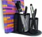 a pen holder with pens in it