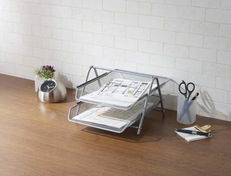 A metal tray with papers and a clock on a wood surface
