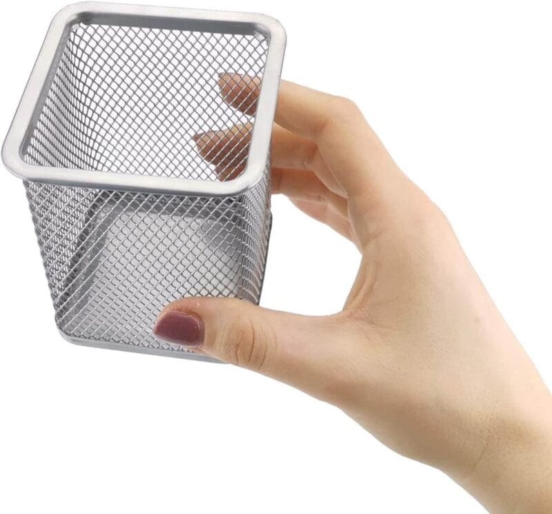 A hand holding a metal basket