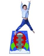 a boy jumping on a rug