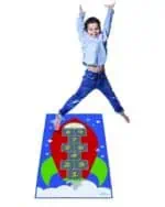 a boy jumping on a rug