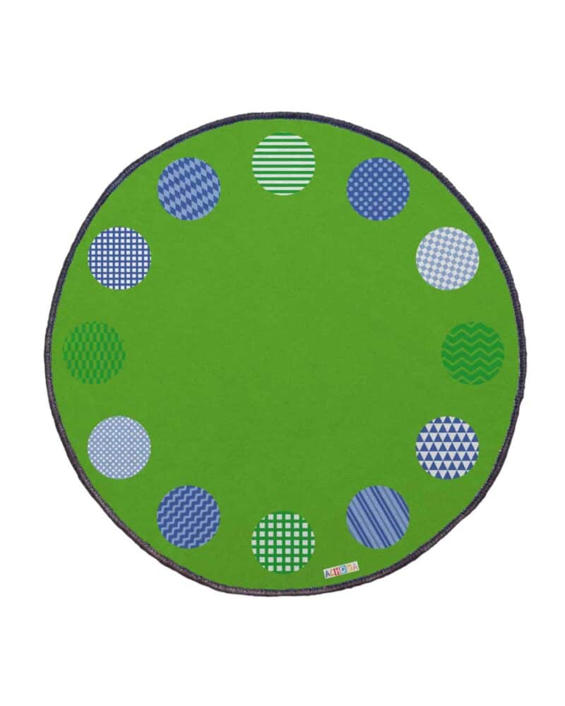 A green rug with blue and white circles