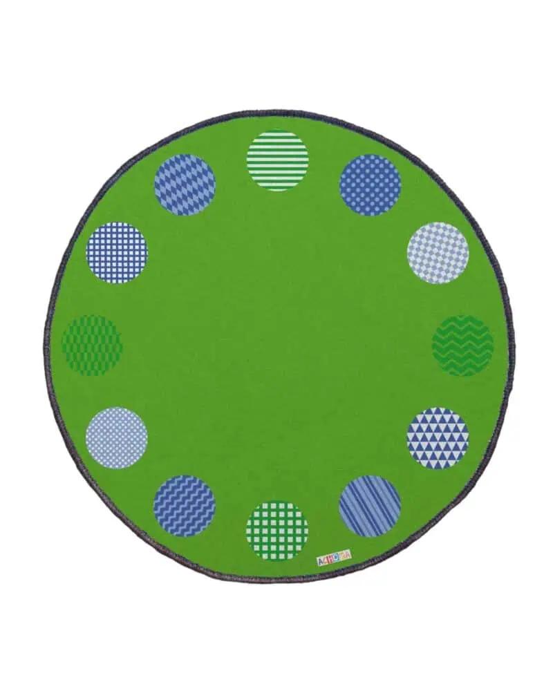 a green rug with blue and white circles