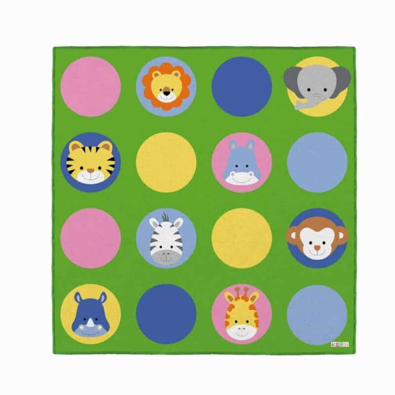 A green rug with animals on it