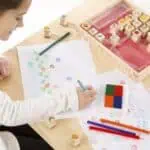 Colorful art supplies and drawings.