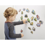 Child playing with colorful magnets.