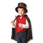 Child magician in red costume.