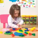 Child playing with colorful modeling clay.
