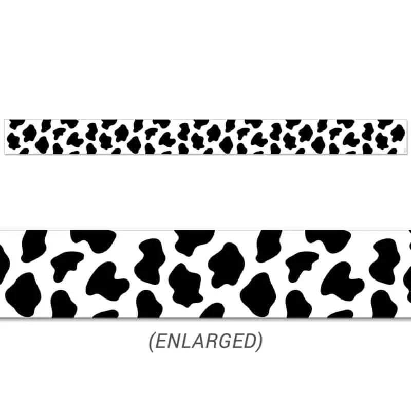 a close-up of a strip of black and white cow spots