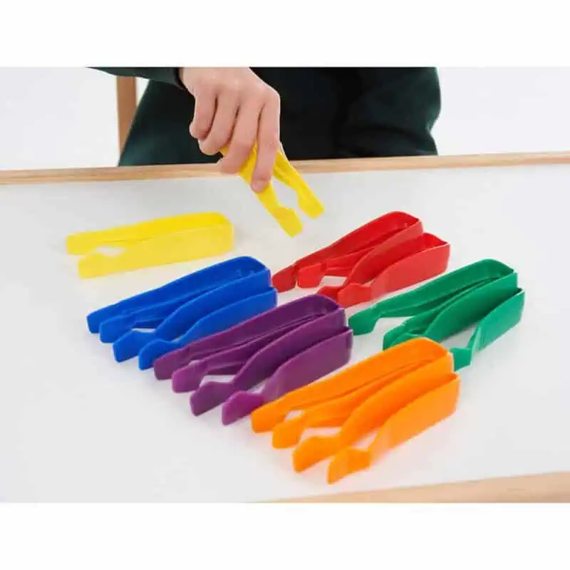 A hand holding a yellow tweezers