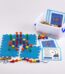 A plastic container with colorful pieces and a plastic box with cards