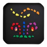 a black tray with colorful stones on it