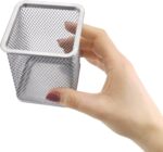 a hand holding a metal basket