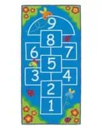 a blue rug with white numbers and butterflies
