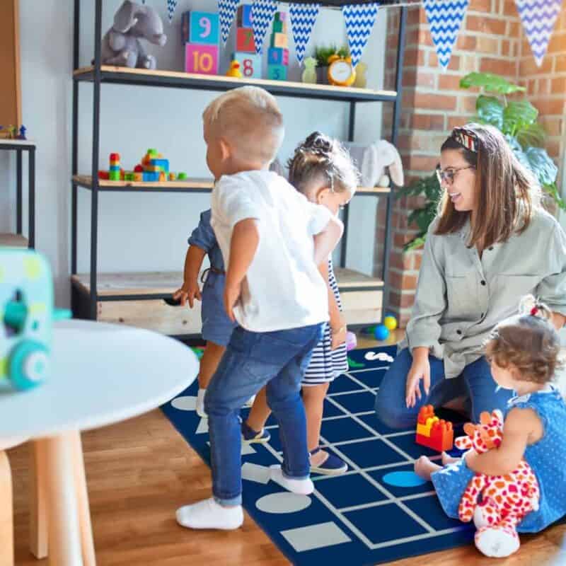 A woman and children playing with toys