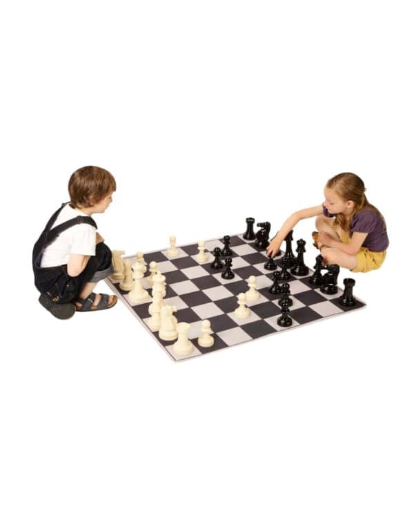 a boy and girl playing chess