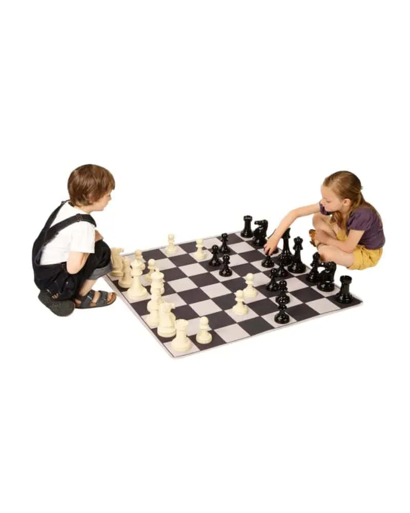 A boy and girl playing chess