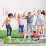 a group of kids jumping in a room