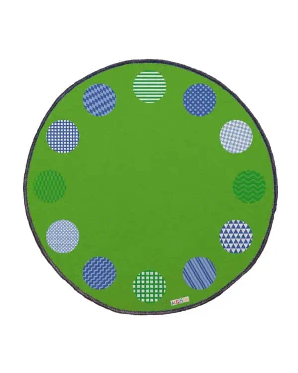 a green rug with blue and white circles
