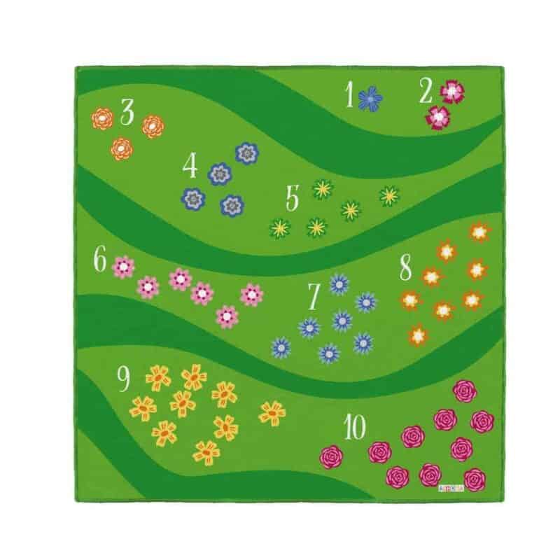 A green carpet with flowers and numbers