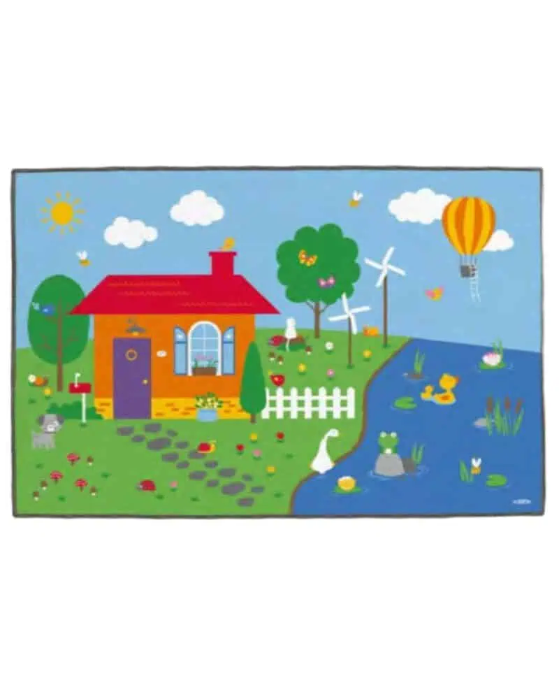 A rug with a house and a pond