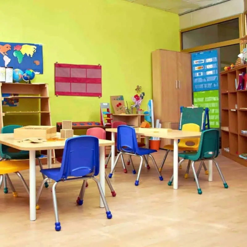 A classroom with tables and chairs